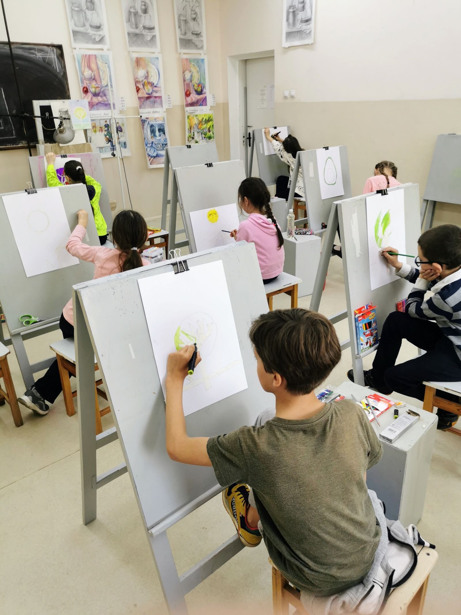 Young artist participating in creative art learning
